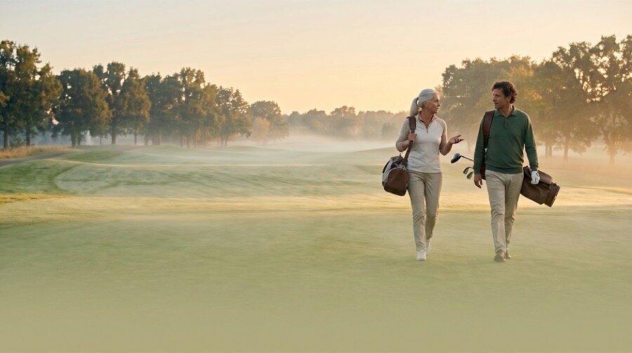A couple walking a misty path